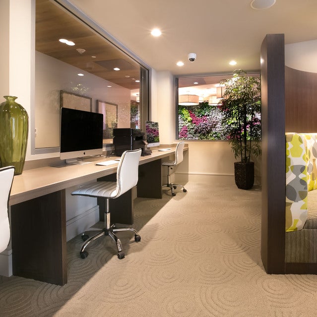Fuse Cambridge Apartments - business center with desktop computers, printer, and seating