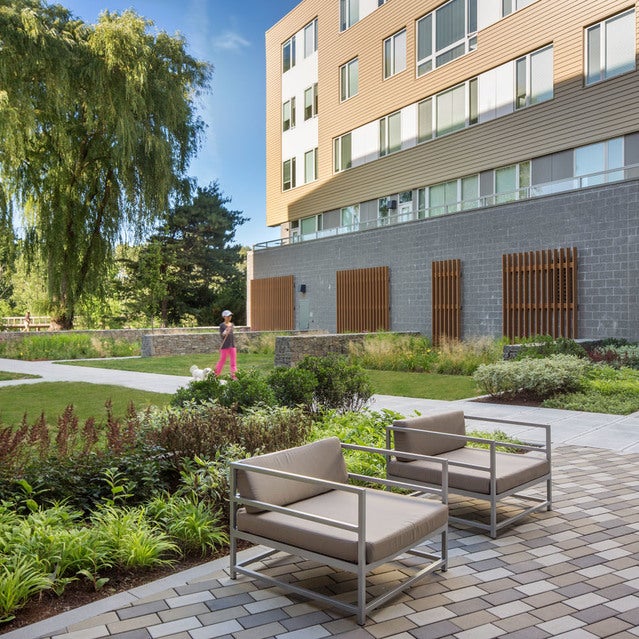 Fuse Cambridge Apartments - courtyard with outdoor seating, walking path and beautiful green landscaping