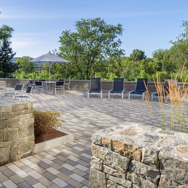 Fuse Cambridge Apartments - outdoor kitchen with grills, tables and chairs